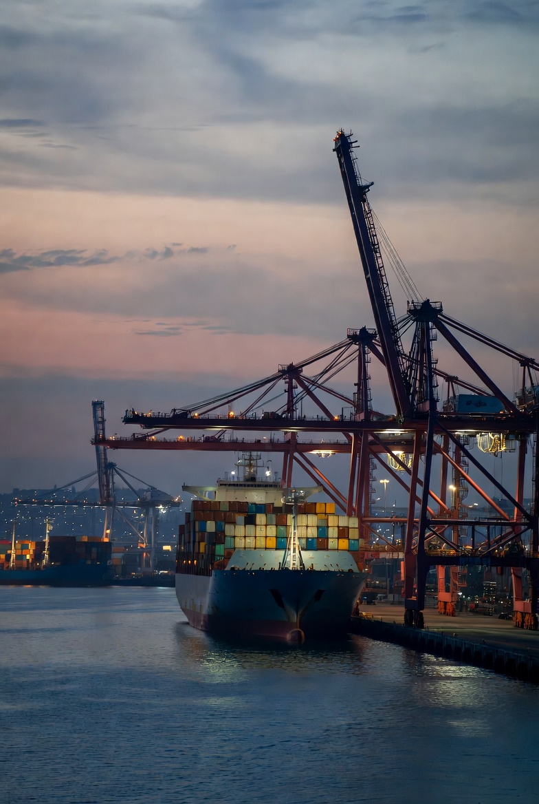 Gantry cranes loading a container ship at port